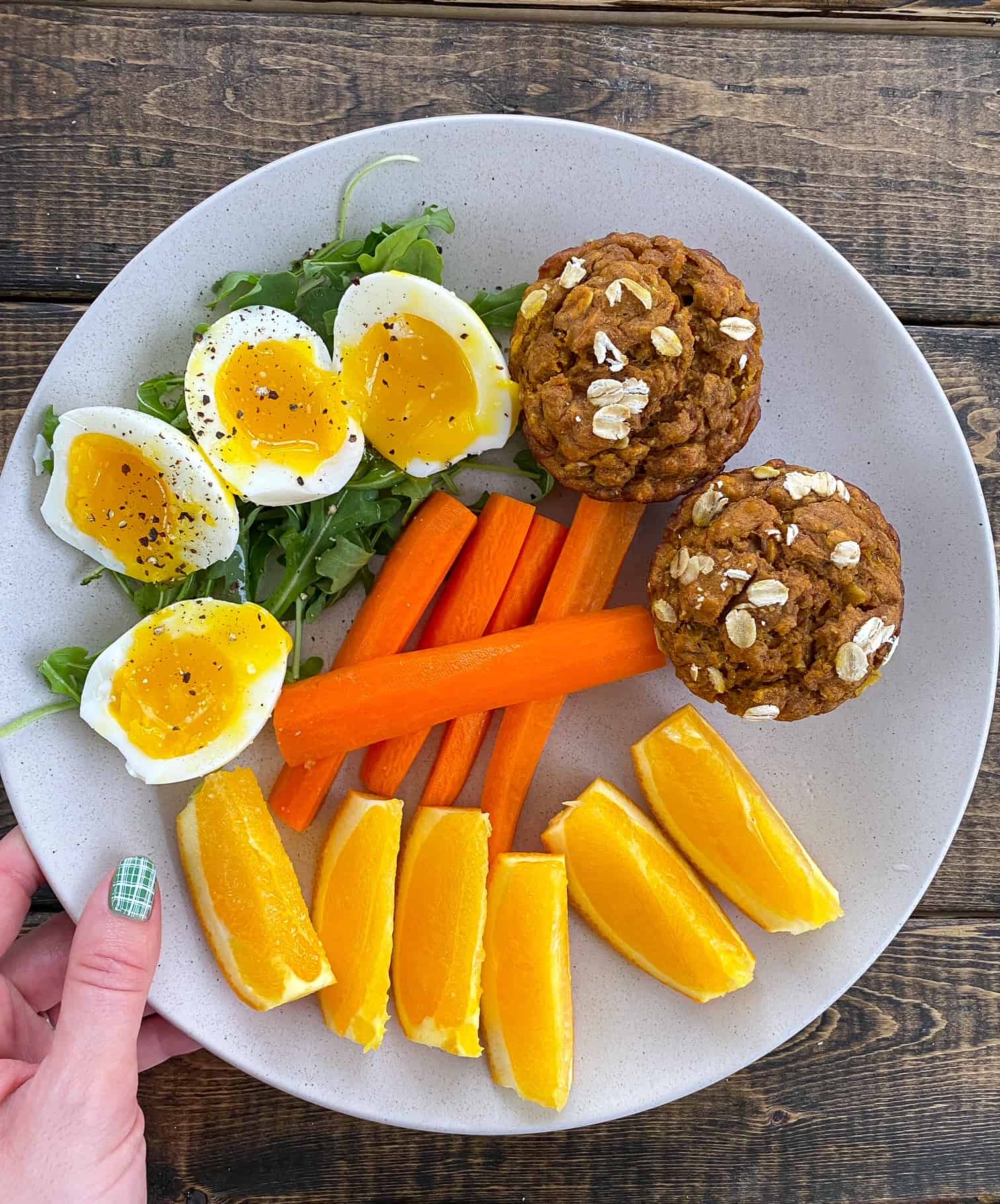 A plated meal with eggs, vegetables, fruit, and a grain serving to illustrate the kind of food photo someone could log in the See Food Diet Program.